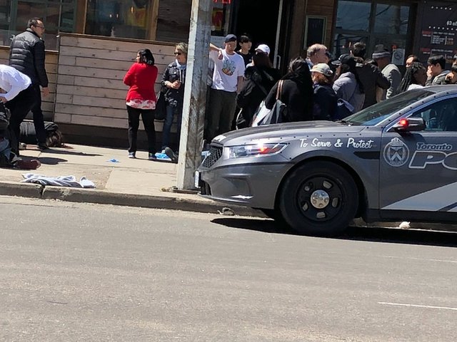 Van strikes pedestrians near busy Toronto street